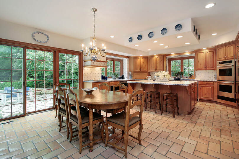 A picture of a kitchen with a tile floor.